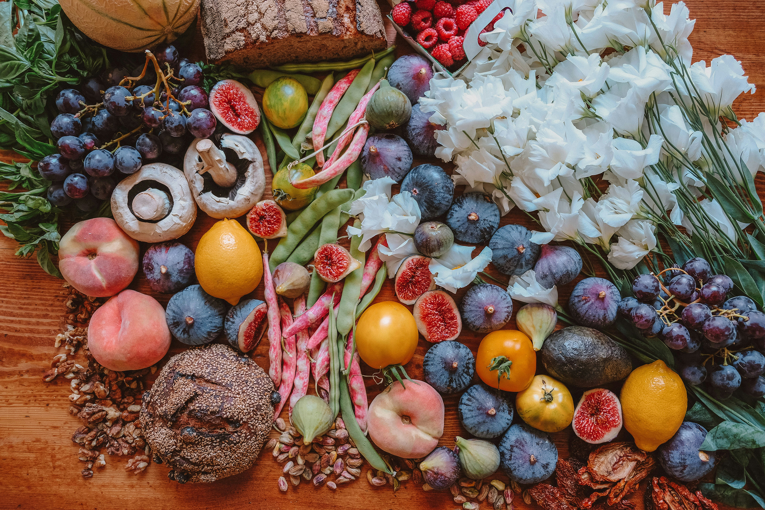 An assortment of fruit and veggies on a table.